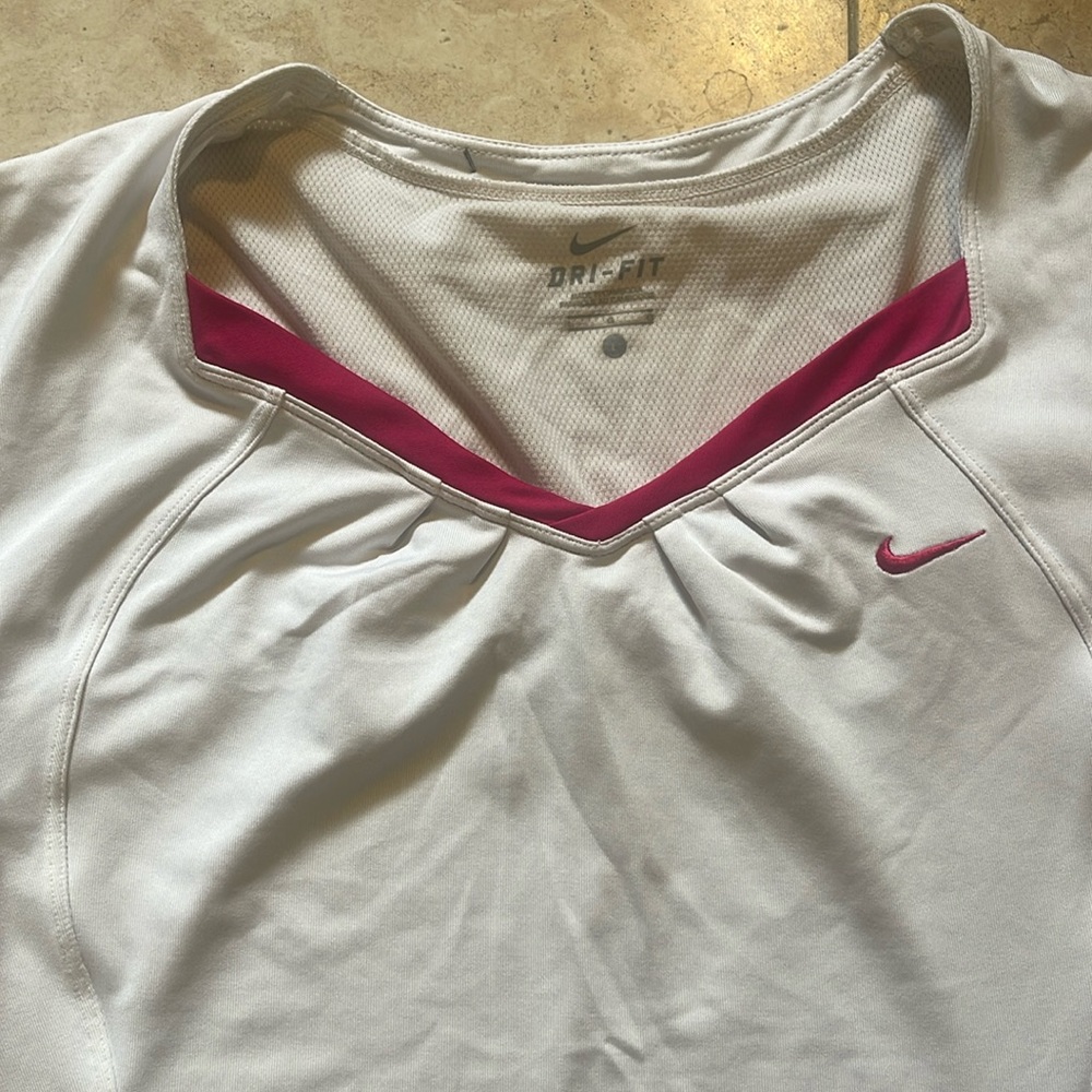 Women’s size L Nike shirt. Also, have matching skirt.